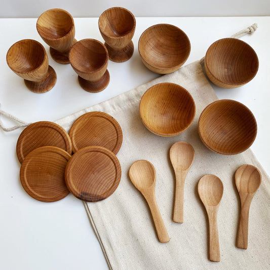 Set of small, tea party-sized wooden dishes, includes 4 egg cups, 4 bowls, 4 spoons, 4 plates